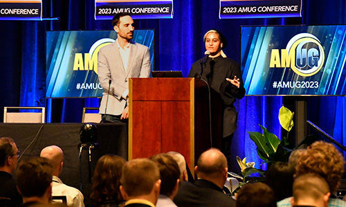 Two speakers presenting from the main stage at the AMUG Conference.